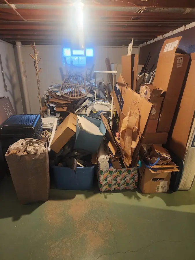 Roll-off dumpster container at job site for 2 Yard Dumpster Rental in Henrietta